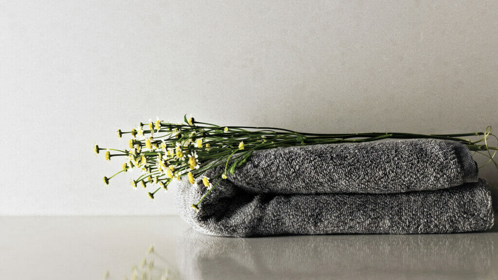 Caesarstone ICON 4600 Organic White  Surface with yellow flowers 