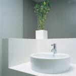 Caesarstone's 2141 Blizzard white countertop with feminine fixtures