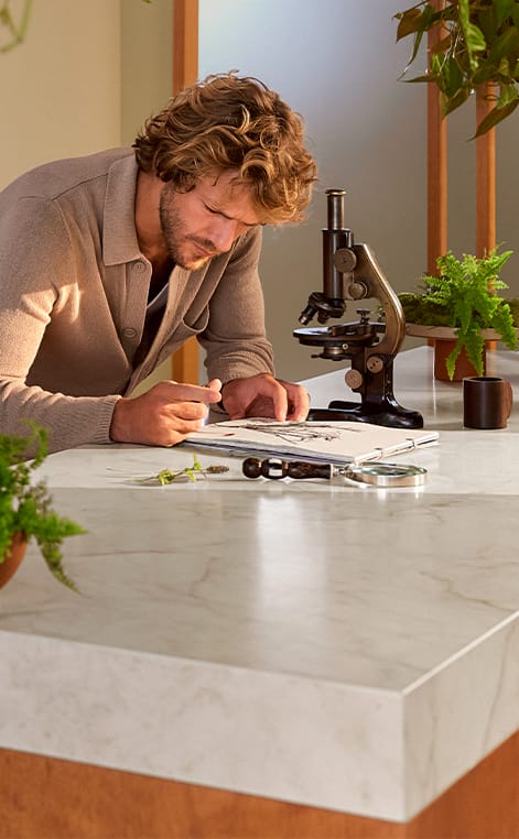 Marbannova porcelain countertop in white with gold, taupe, and gray veining