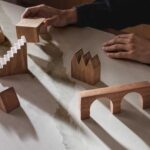Wooden blocks sit atop an advanced fusion countertop of Calacatta Nobella, a silica-free* quartz alternative, with light-gray veins, accented by warm copper tints.