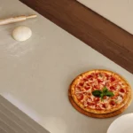 Caesarstone ICON 4201 Organic Dune beige surface with pizza